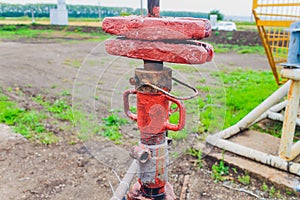 Detail of oil pipeline with valves in large oil refinery.