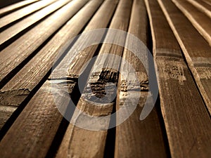 Detail of an old bamboo table in the sunshine. Close up of bamboo table. Empty bamboo table or meja bambu photo