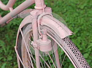 Detail of old bicycle with the bottle dynamo device for the head