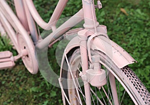 Detail of old bicycle with the bottle dynamo on the front wheel