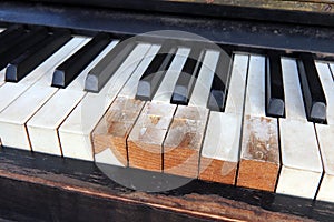 Detail of old, broken and dusty claviature photo