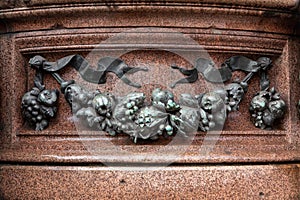 Detail from and old bronze statue in Munich