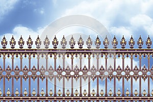 Detail of an old cast iron gate in Wien Austria - Europe against a clody sky - concept image