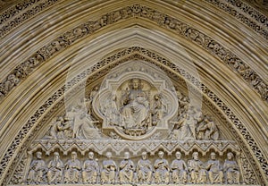 Detail of old church facade. Architectural detail with Jesus Christ, His apostles and angels..