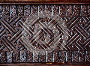 Detail of old decorative wooden panel in bali indonesia