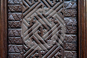 Detail of old decorative wooden panel in bali indonesia