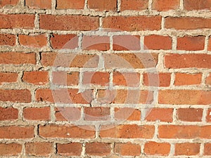 Detail of old exposed red brick wall