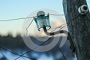 The detail of the old glass electric isolator