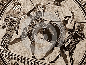 Detail from an old historical greek paint over a dish. Mythical heroes and gods fighting on it photo