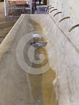 Detail of old marble fountain