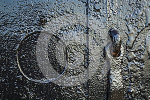 Detail of old metal door in Red Hook, Brooklyn, New York