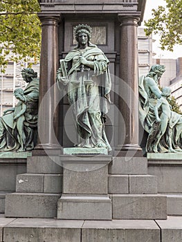 Detail of the old monument with group sculpture