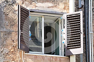 Detail of an old open window in an ancient building