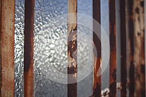 Old rusty grates on the window