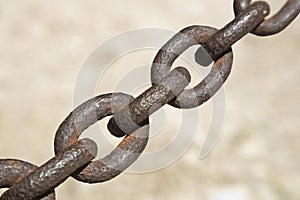 Detail of an old rusty metal chain isolated on colored background - image with copy space