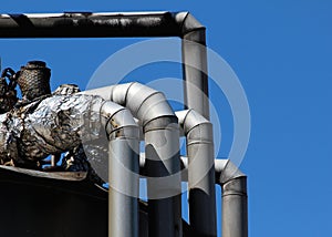 Detail of old silver pipe in heating station