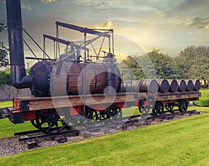 detail of old steam train loading wooden barrel for whisky