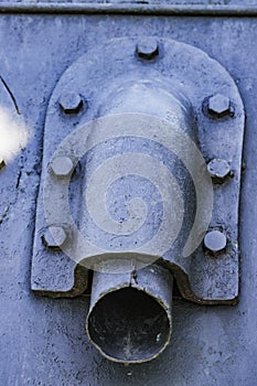 Detail of an old surface with exfoliated paint and rivets on military equipment. Military background