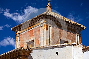 Detail of old tower with windows of house in the old neighborhood of Caravaca, Murcia photo