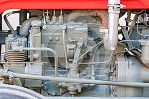 Detail of old tractor machine or engine. Whit visible fuel pump, air compressor, fuel filter and exhaust