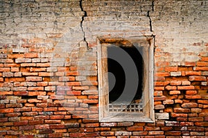 Detail of old weathered brick wall and window