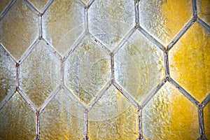 Detail of an old window with handmade leaded glass