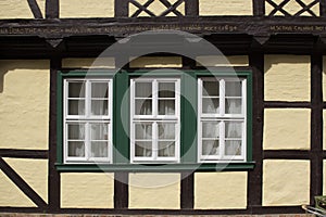 Detail of old windows in a street of Old Town in Quedlinburg Germany.