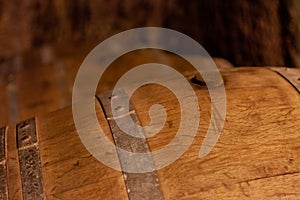 Detail of old wooden barrell in a cellar, Tuscany