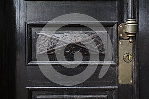 Detail of old wooden door, lock and handle