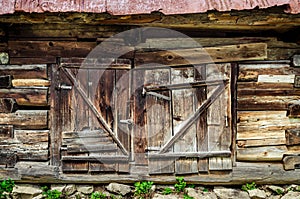 Detail of old wooden textured and weathered barn door