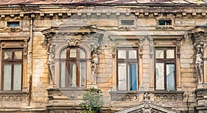 Detail with an old worn out building. Old vintage architecture in Bucharest, Romania
