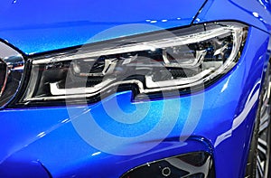Detail of the one LED headlights blue car