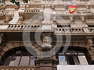 Detail of ornate building facade in Madrid, Spain.