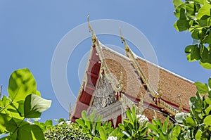 Detail of ornately decorated temple roof in thailand