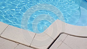 Detail outdoor open air swimming pool with clean blue water in web template banner