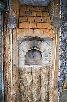 Detail of an outdoor wood-burning oven.