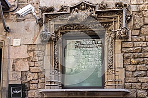 Detail over a window on the stone wall of Picasso Museum in Barcelona, Spain