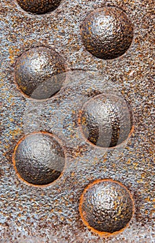 Detail of oxidised steel and rivets