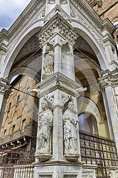 Detail of Palazzo Pubblico, main landmark in Siena, Italy