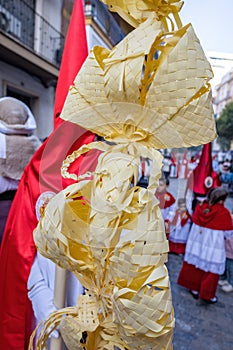 Detail of a Palm made in Elche, Spain, carried by a Nazarene and penitent, in Palm Sunday, during Holy Week, in the La Borriquita photo