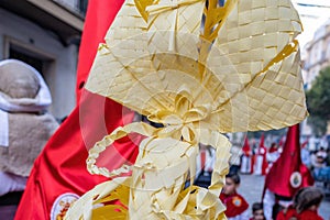 Detail of a Palm made in Elche, Spain, carried by a Nazarene and penitent, in Palm Sunday, during Holy Week, in the La Borriquita photo