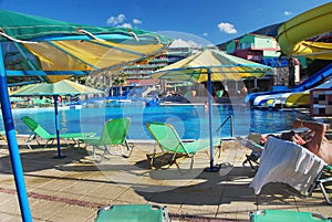 The detail with parasols and deck chairs and a swimming pool