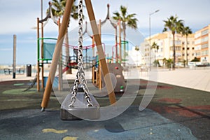 Detail of park swings on a sunny day. Concept of fun and attractions for children