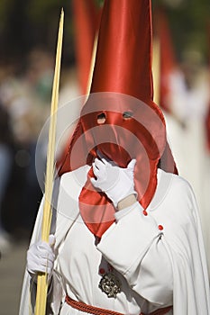 Detail penitent holding a palm during Holy Week photo