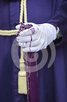 Detail penitent white holding a candle during Holy Week photo