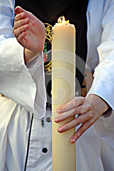 Detail of the penitentÅ› candle at a procession in Carmona 2s