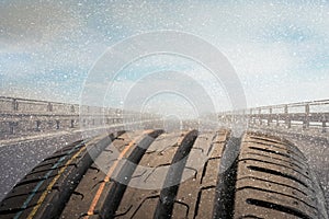 Detail photo of a car tire on a road