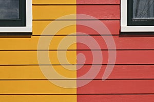 Detail photo of red and yellow painted houses
