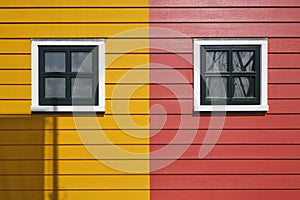 Detail photo of red and yellow painted houses