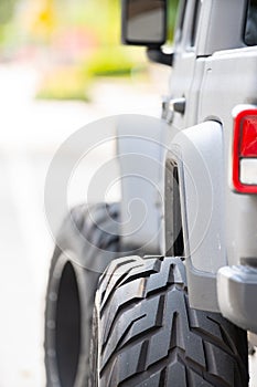 Detail photo of a tough off road vehicle with oversized big tires